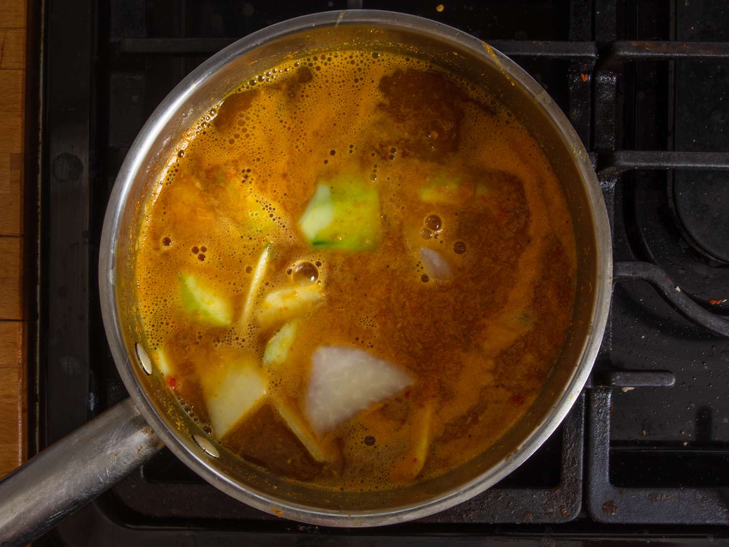 adding papaya to curry