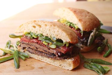 Cross section view of Chilean steak sandwich with cut green beans