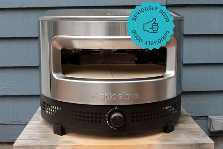 solo stove pi prime pizza oven on a wooden table