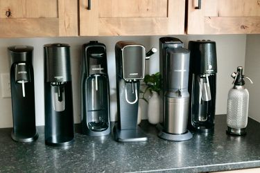 several soda makers on a kitchen countertop