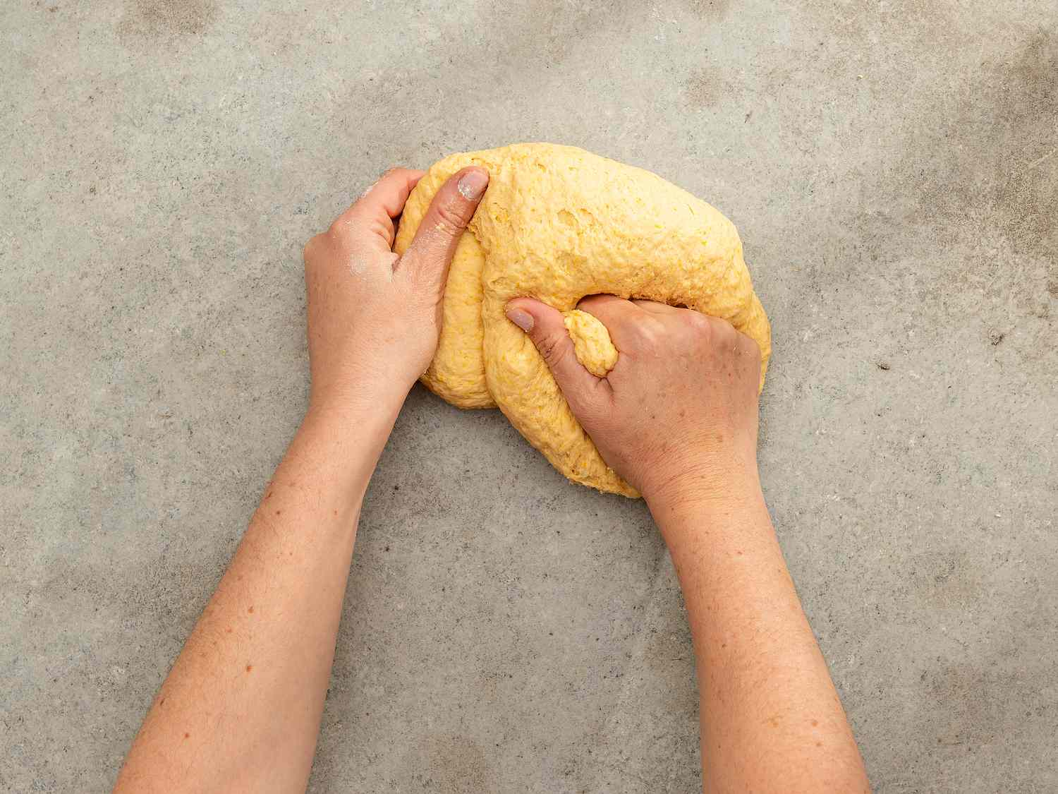 Overhead view of kneading dough