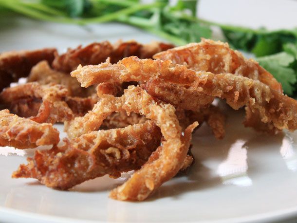 Close-up of strips of tripe that have been fried golden brown.