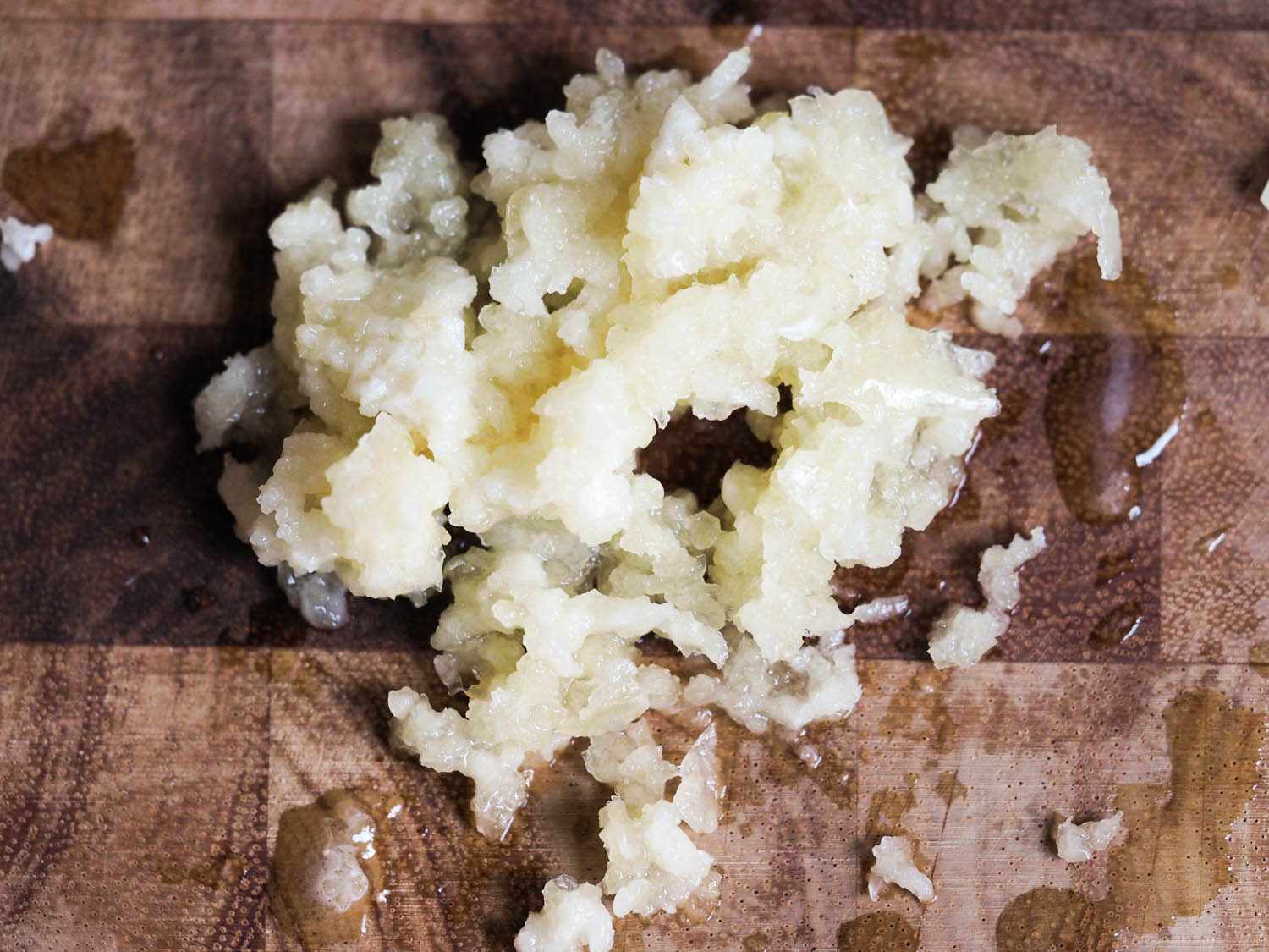 An overhead photo of a pile of minced garlic.