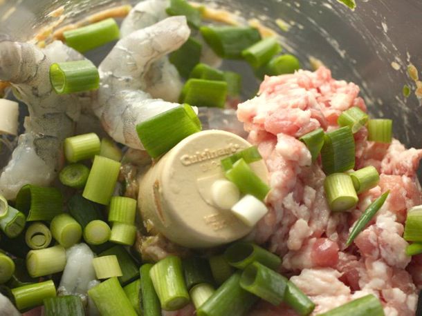 虾, ground pork, and scallions ready to be puréed in the bowl of a food processor.
