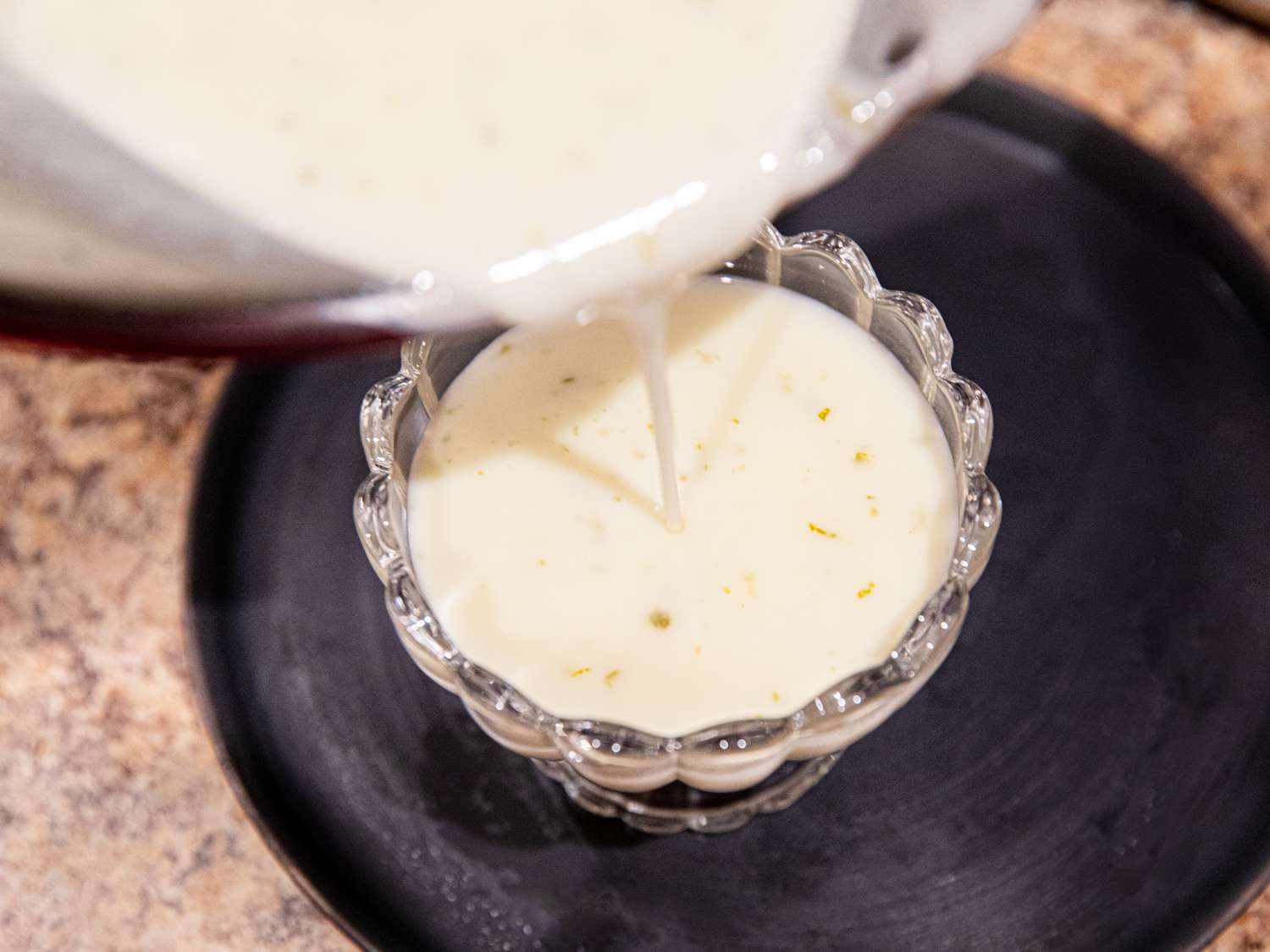 Pouring mixture into posset