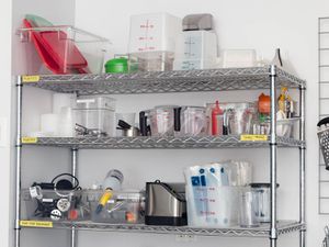 a close up of a metro rack shelving unit filled with kitchen equipment from the Serious Eats test kitchen