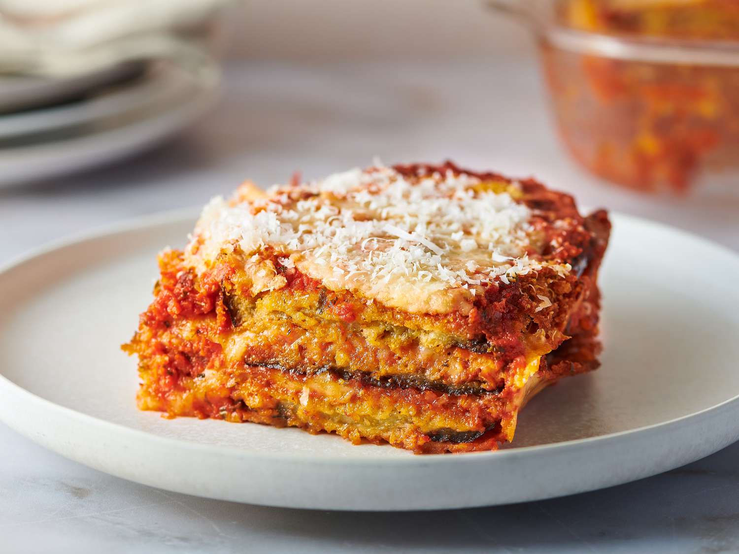 Slice of eggplant parmesan served on a plate