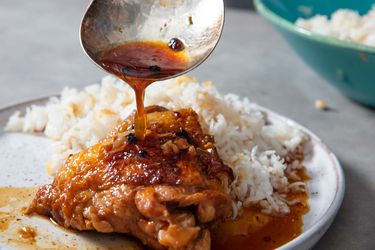 Chicken adobo with white rice on a plate