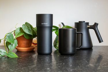 our two favorite temperature control mugs on a countertop