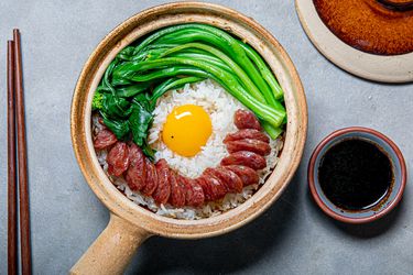 Cantonese clay pot rice with Chinese sausage and greens.