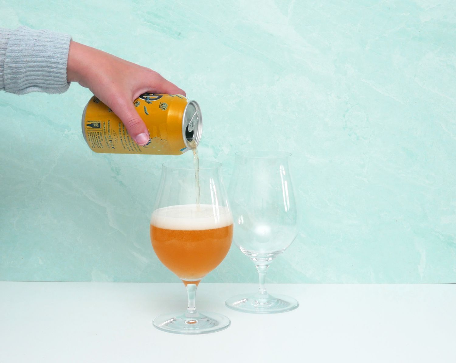 pouring beer into tulip glass