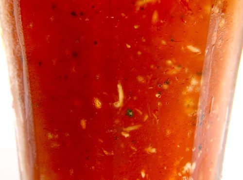 Close up photo of bloody mary in a glass.