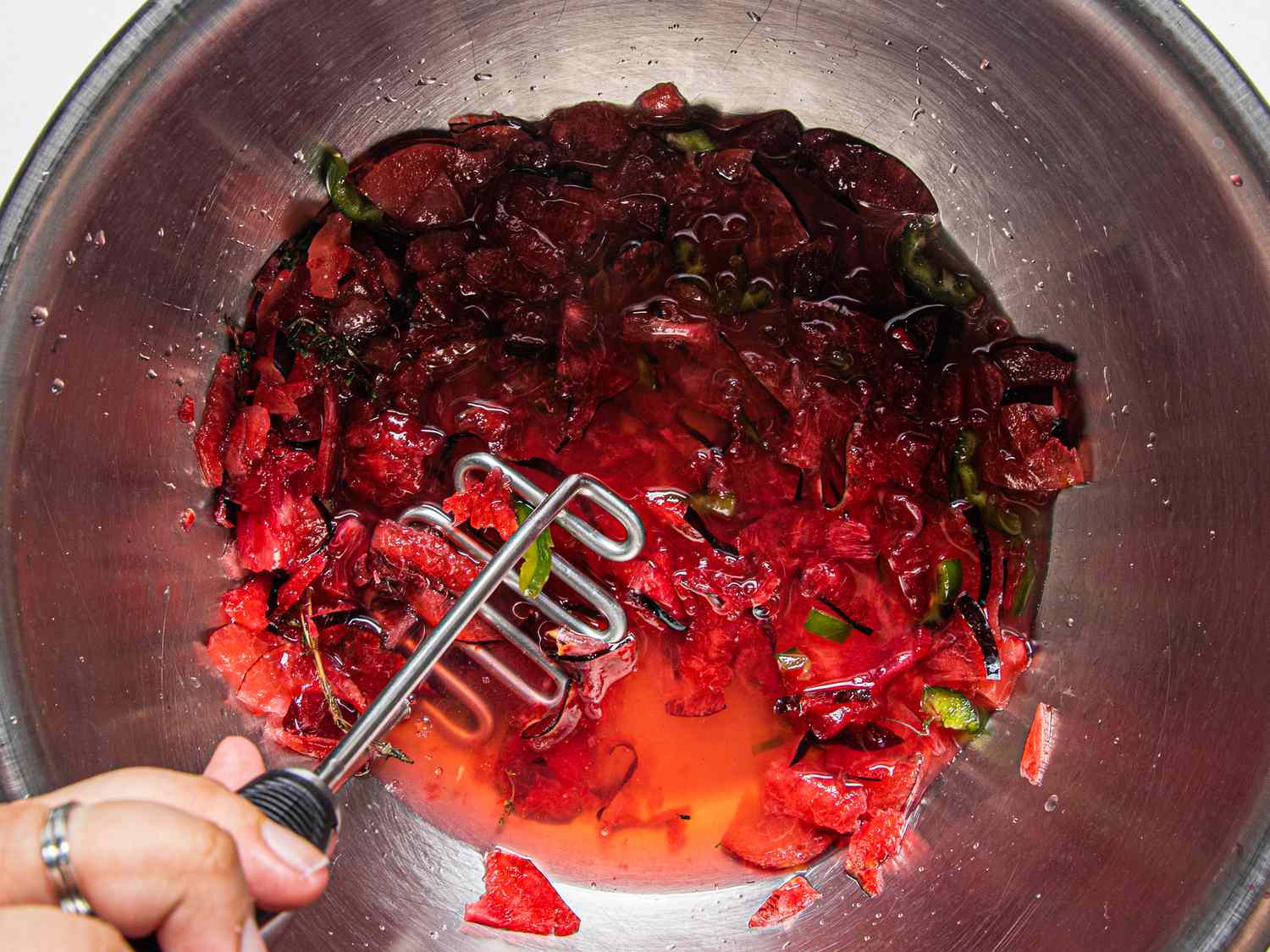 Muddling plums, chiles and thyme