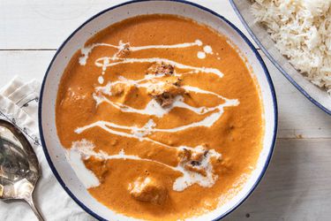 Butter chicken in a white bowl