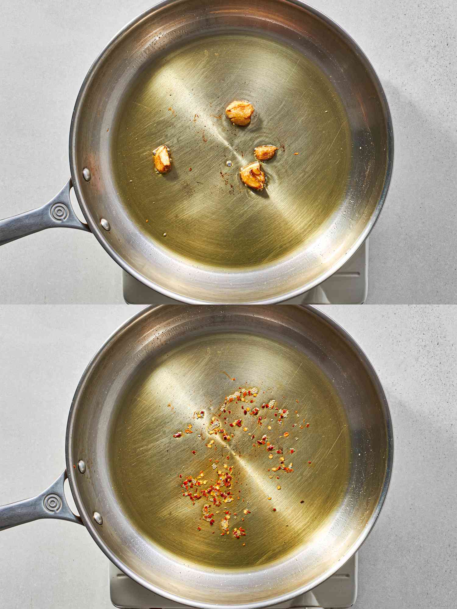 Browned garlic inside a skillet and red pepper flakes added to a skillet