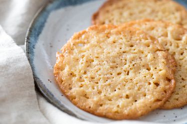 A small plate of lace cookies, an example of a baking recipe that doesn't require a stand mixer.