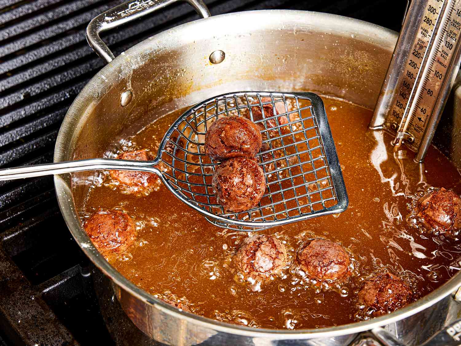 Overhead view of frying doughnut holes