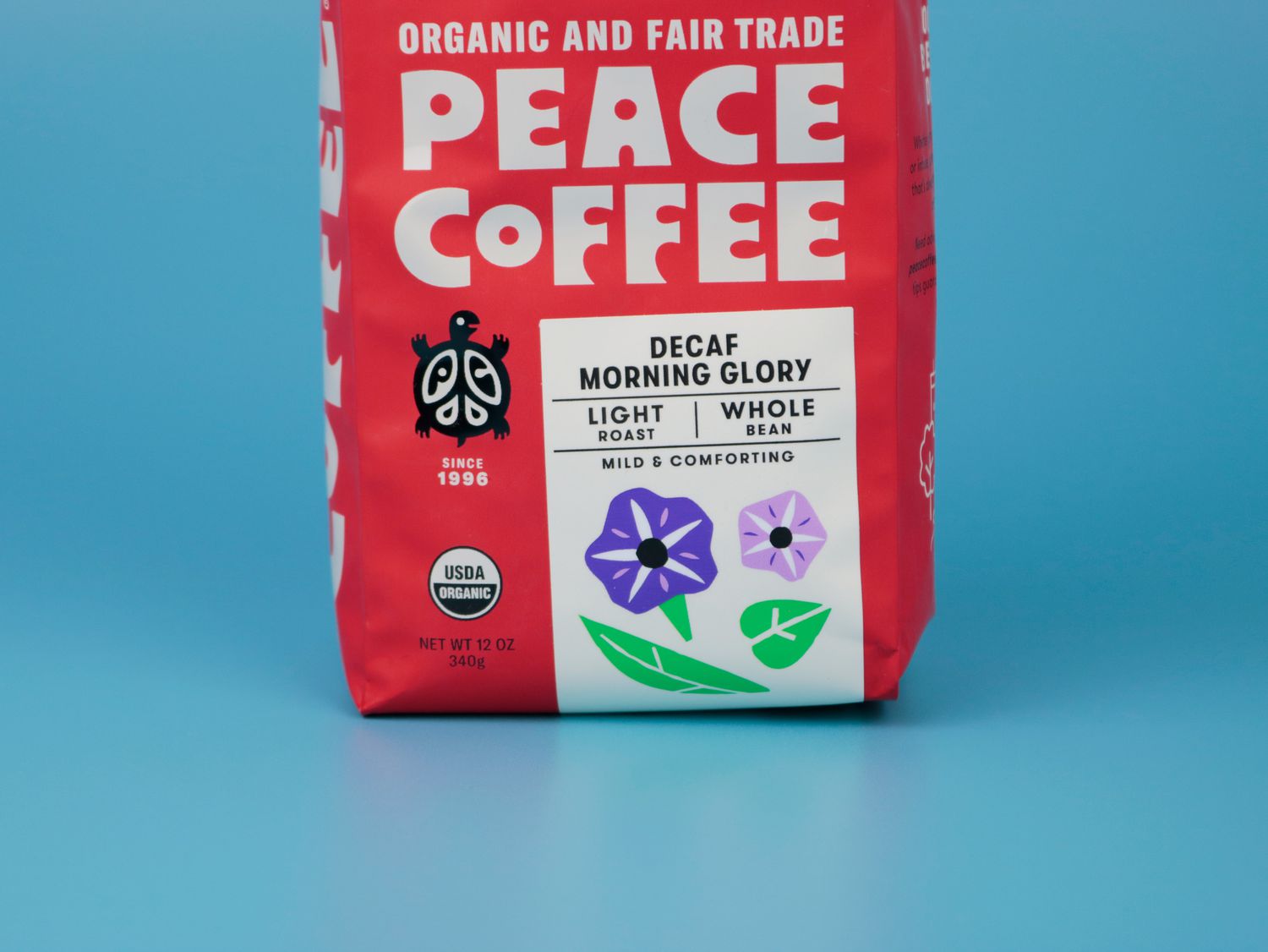 the front of a bag of coffee showing organic and fair trade certifications