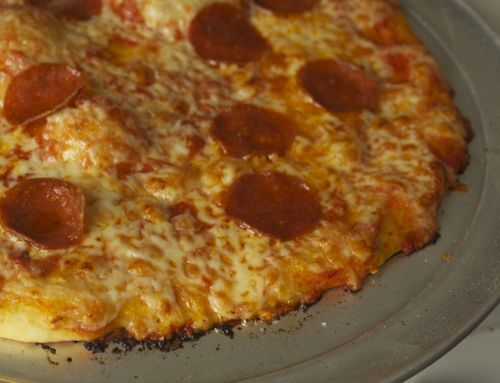 A close up of cooked pepperoni bar pizza.