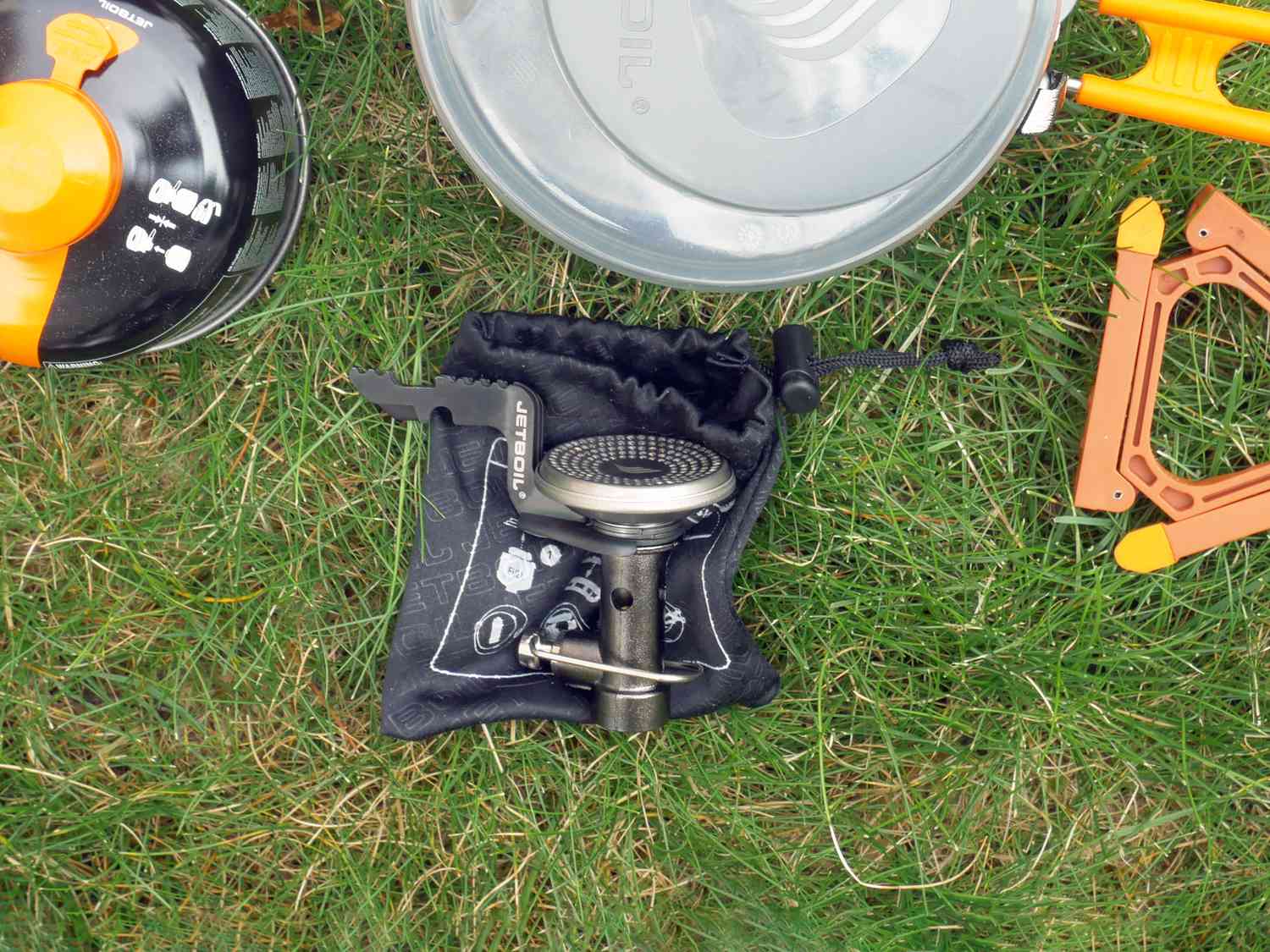 Stash stove folded up on grass