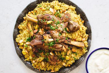 Overhead view of Qidreh with a side plate of yogurt