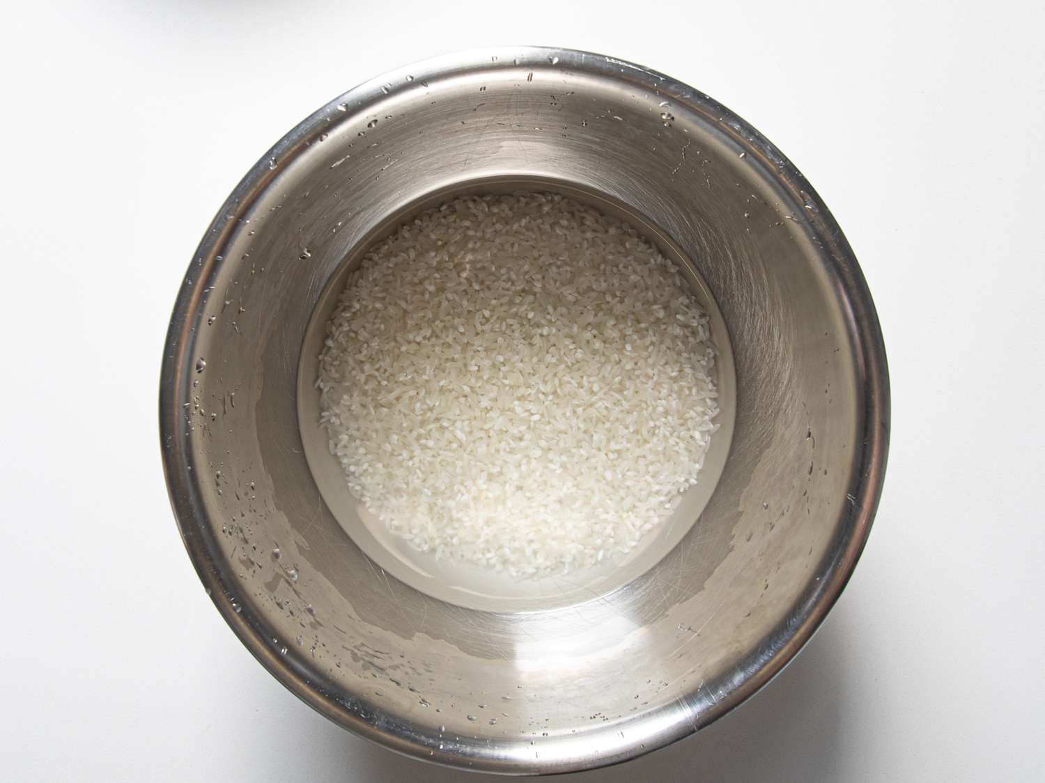 Rice soaking in a bowl.