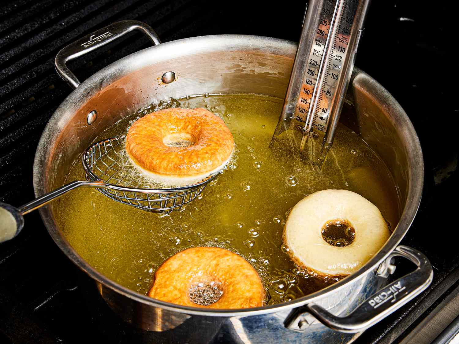 Overhead view frying donuts