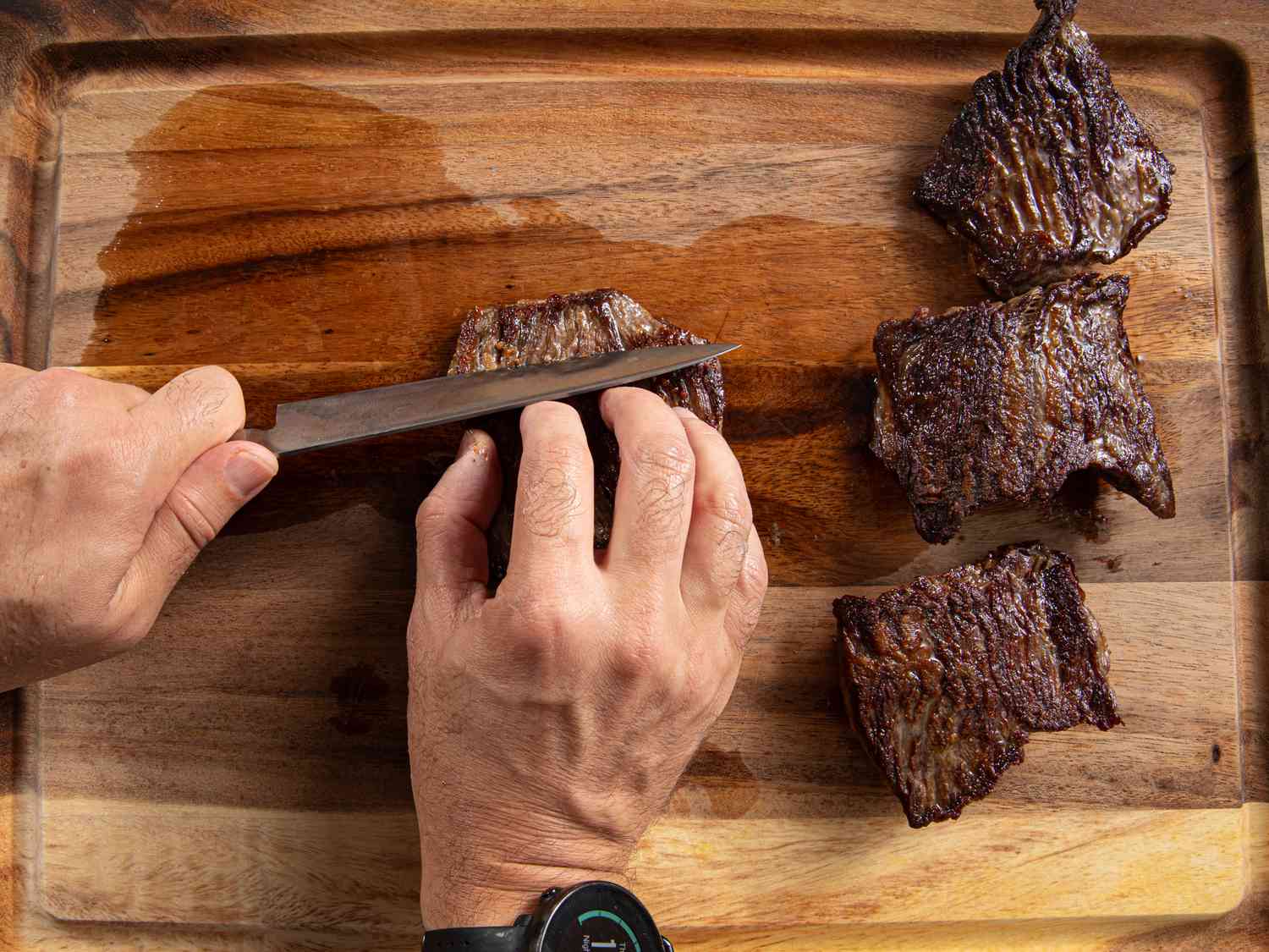 Overhead view of cutting meat against the grain