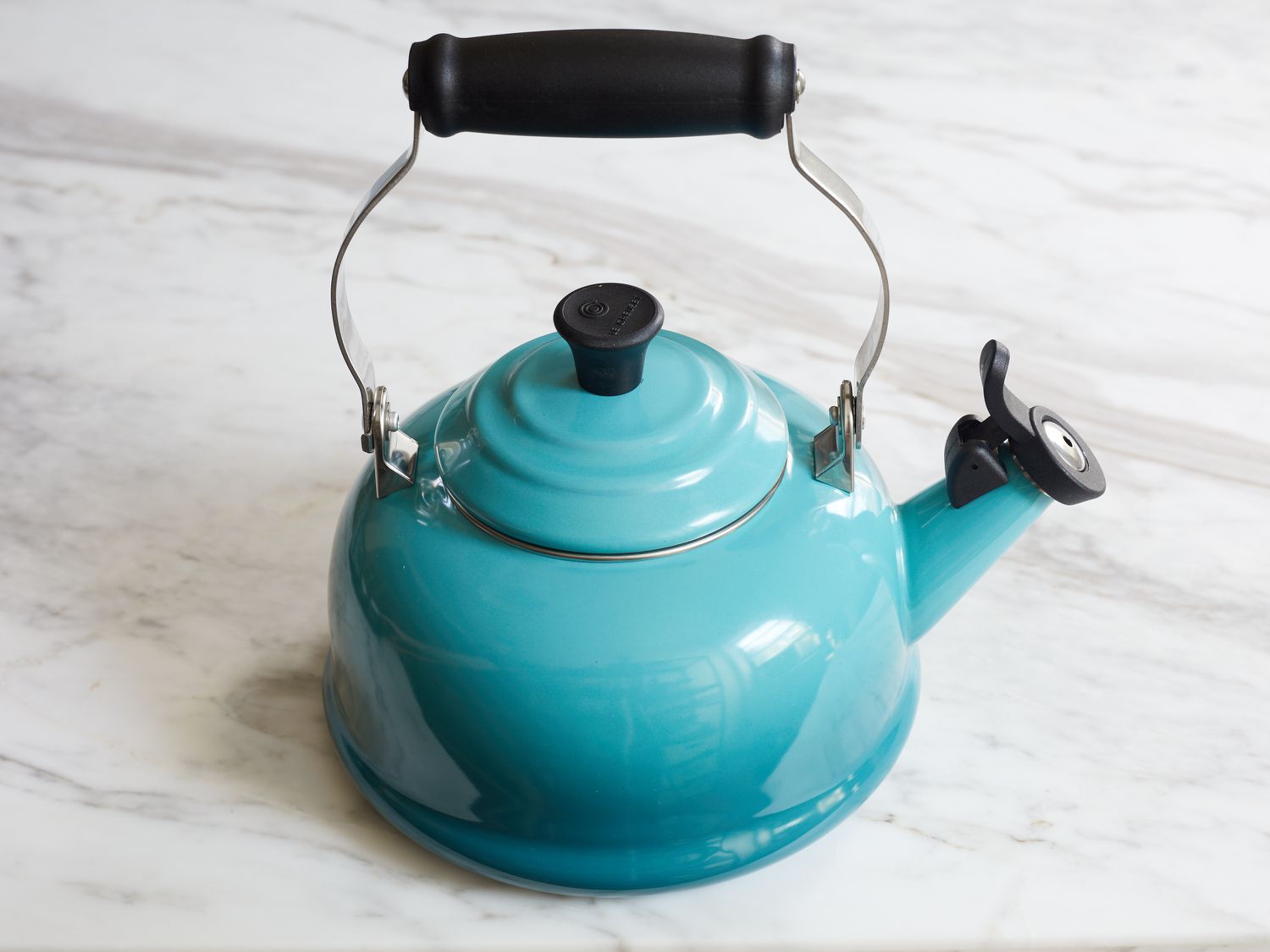 The Le Creuset kettle on a marble backdrop