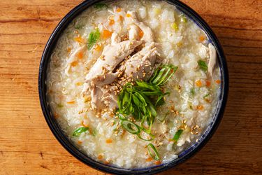 Overhead view of homemade dak juk, a comforting Korean rice porridge.