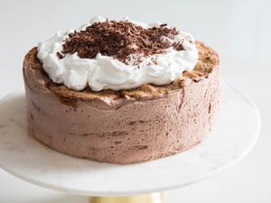 Mocha Icebox Cake topped with whipped cream and chocolate shavings
