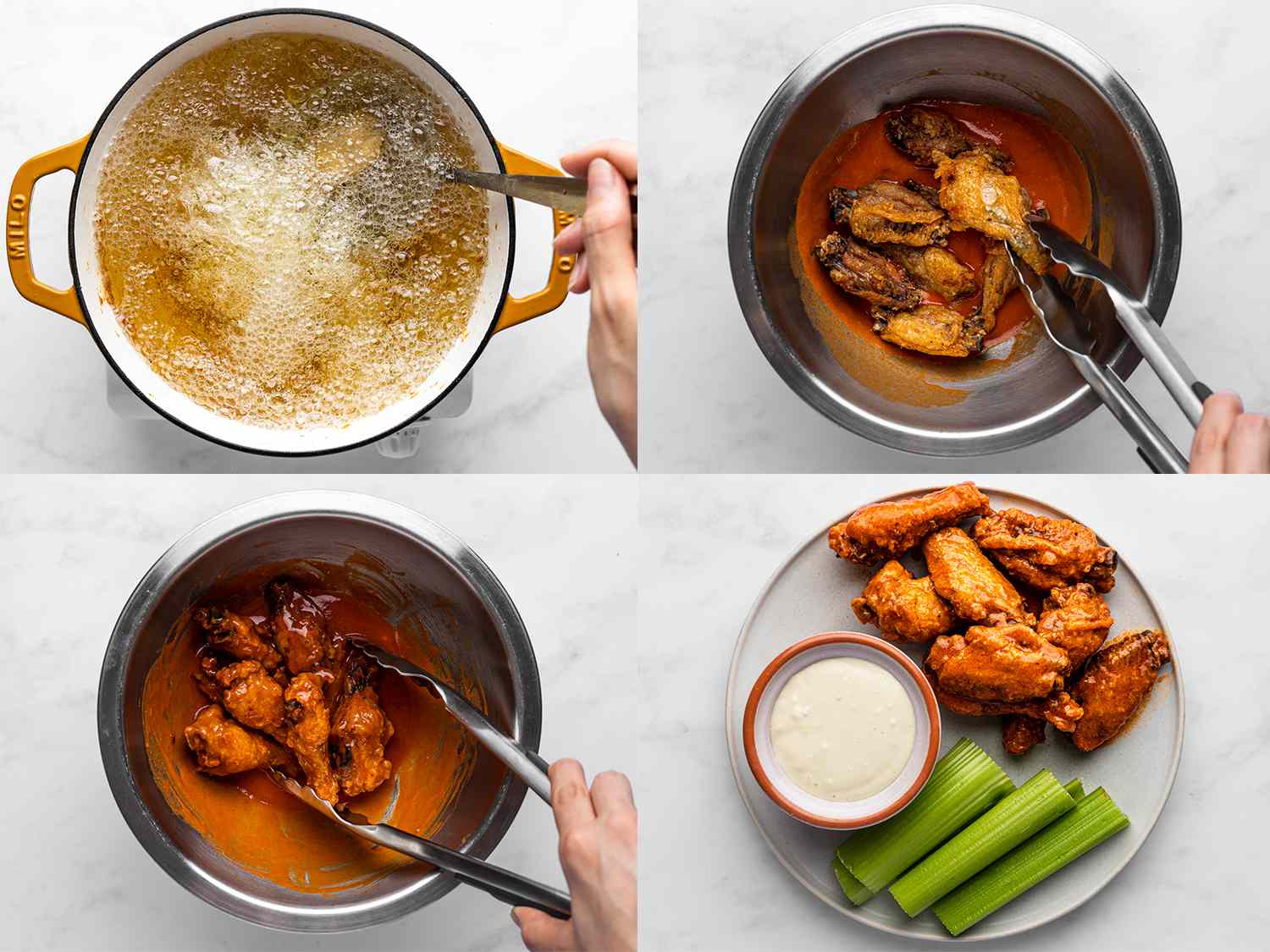 A horizontal four-image collage. The top left photo shows the par-cooked chicken wings being fried a second time in a dutch oven, with a metal spoon moving the chicken wings as the oil rapidly boils. The top right photo shows the fried chicken wings being tossed using tongs with buffalo sauce in a metal bowl. The bottom left photo shows the chicken wings coated in sauce, being moved around the bowl with a pair of metal tongs. The bottom right image shows the buffalo wings on a plate with sliced celery sticks and a small bowl of bleu cheese dressing, on a white stone background.