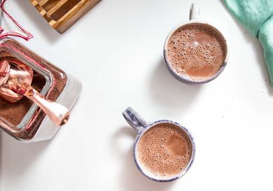 overhead view of two mugs of hot cocoa