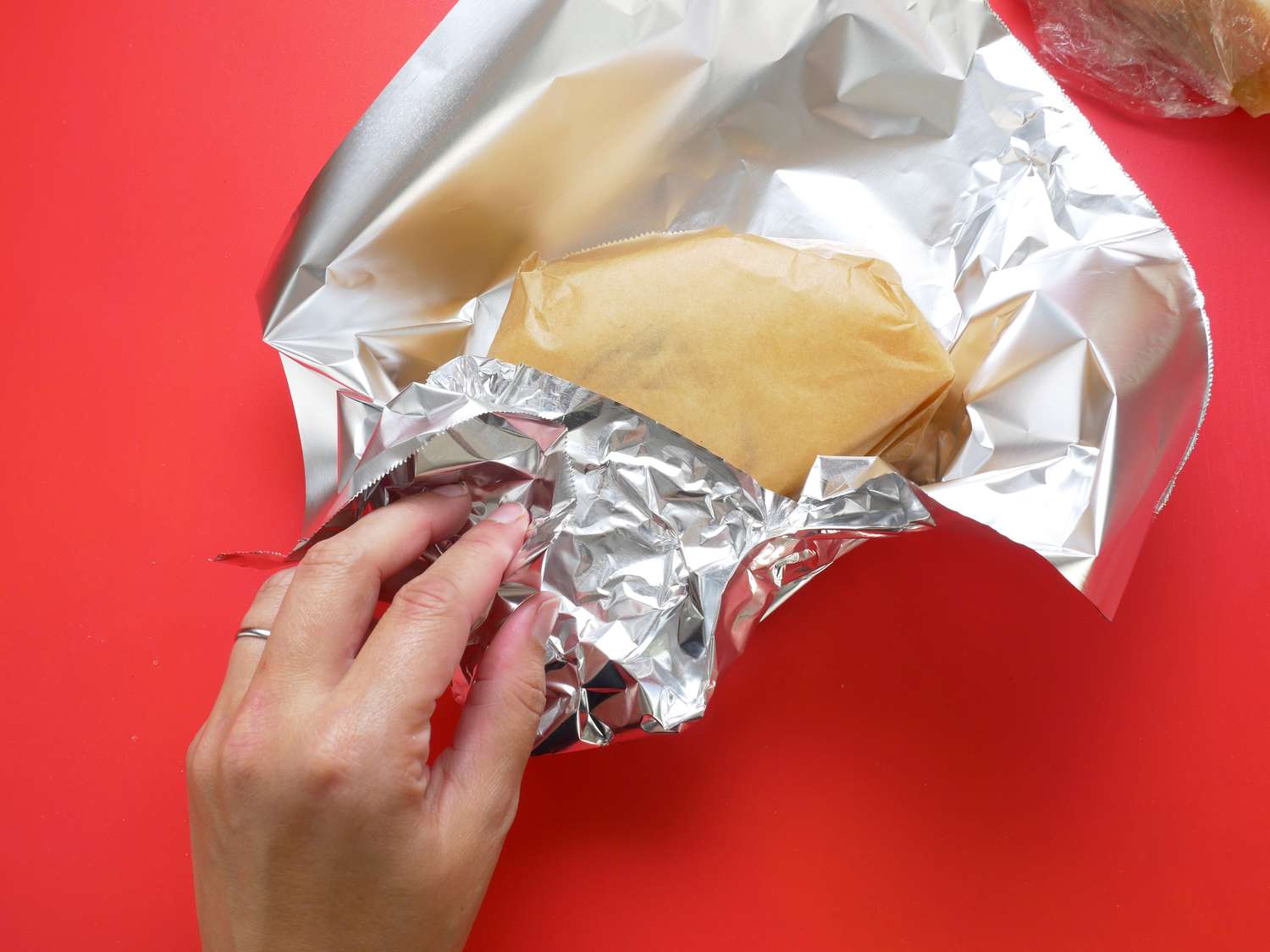 wrapping cheese in parchment paper and aluminum foil