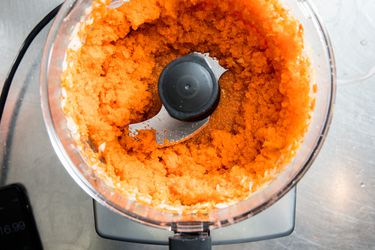 Minced carrots in a food processor bowl