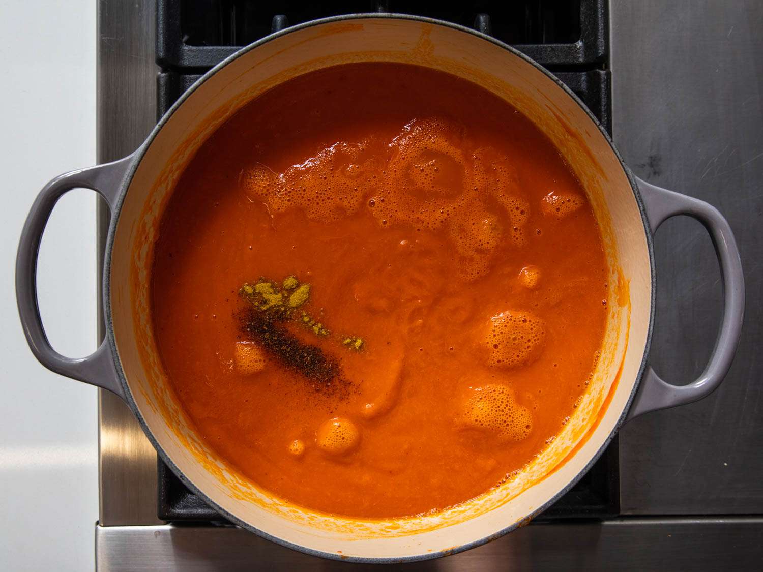 A pot of obe ata simmering on the stove.