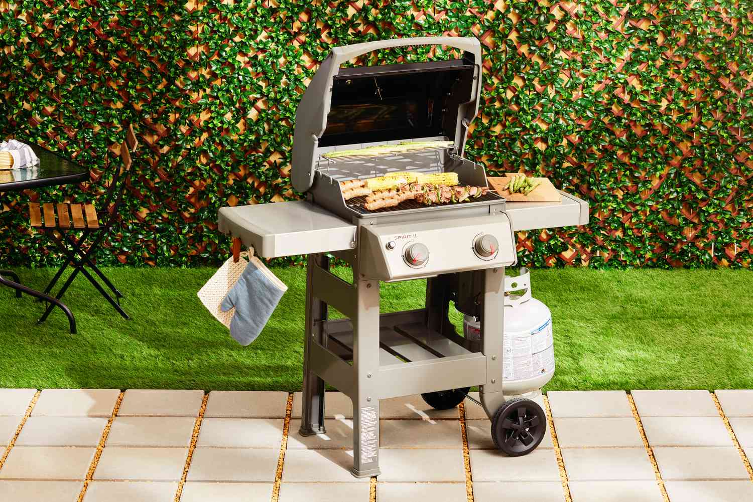 a two-burner gas grill on a patio