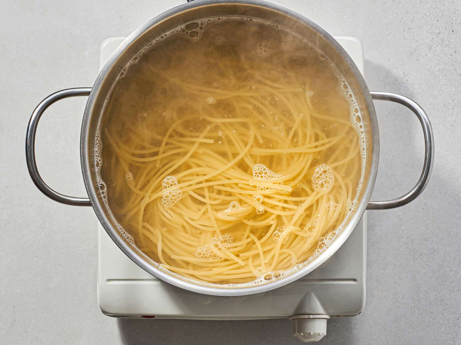 Pasta just shy of al dente inside pot