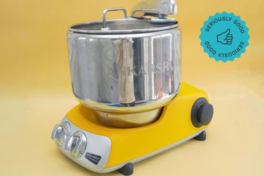 ankarsrum stand mixer on yellow background