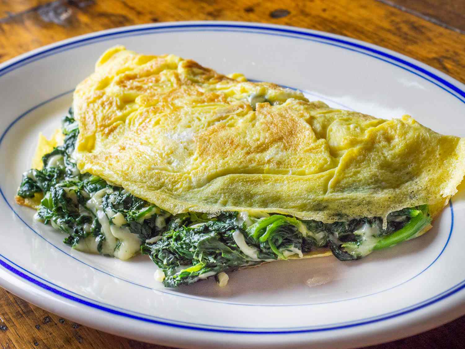 A spinach and cheese omelette plated
