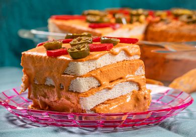 Side view of a piece of Pastel de Atun on a festive pink plate