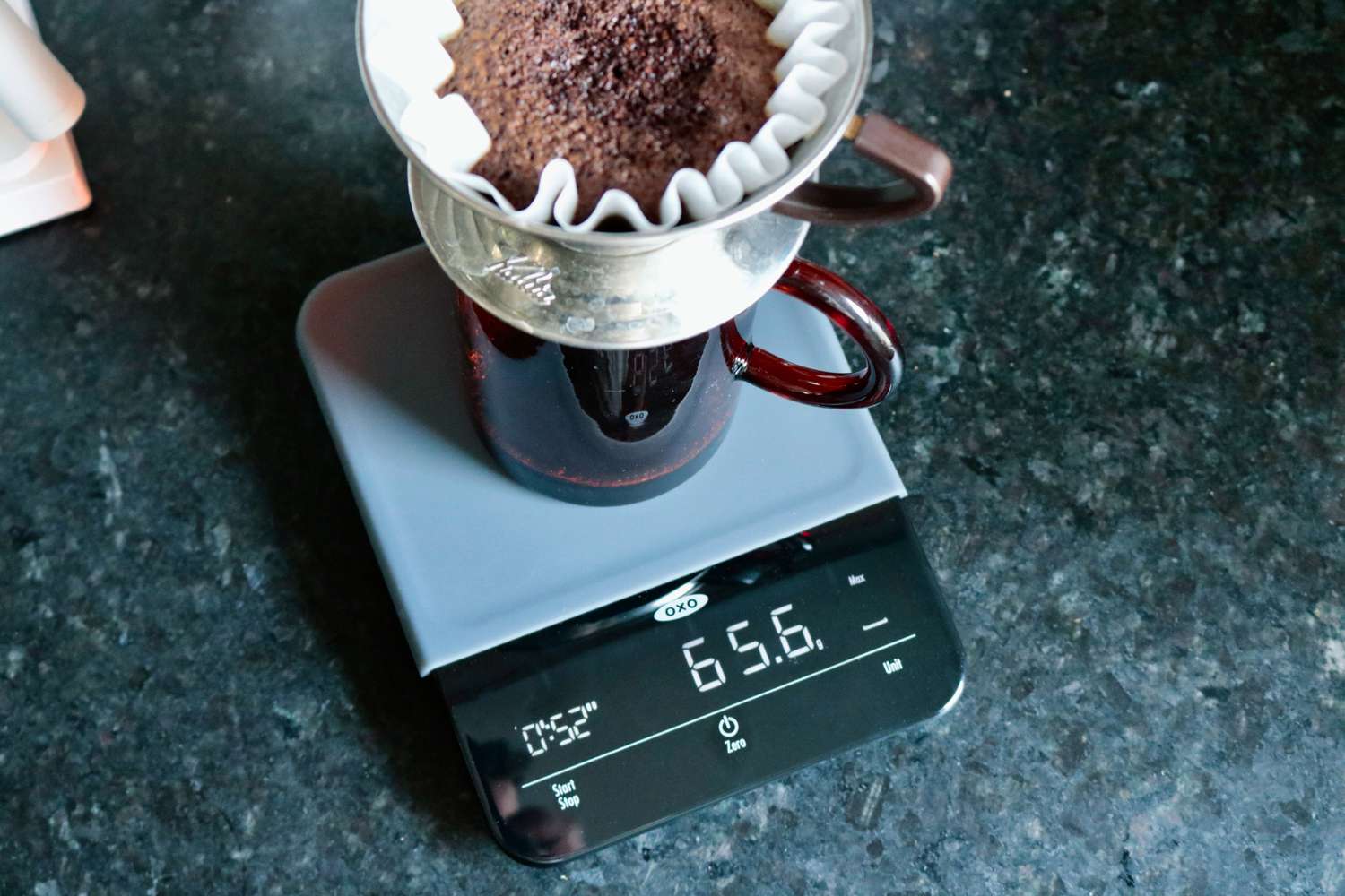 brewing coffee in a pourover brewer on the OXO scale