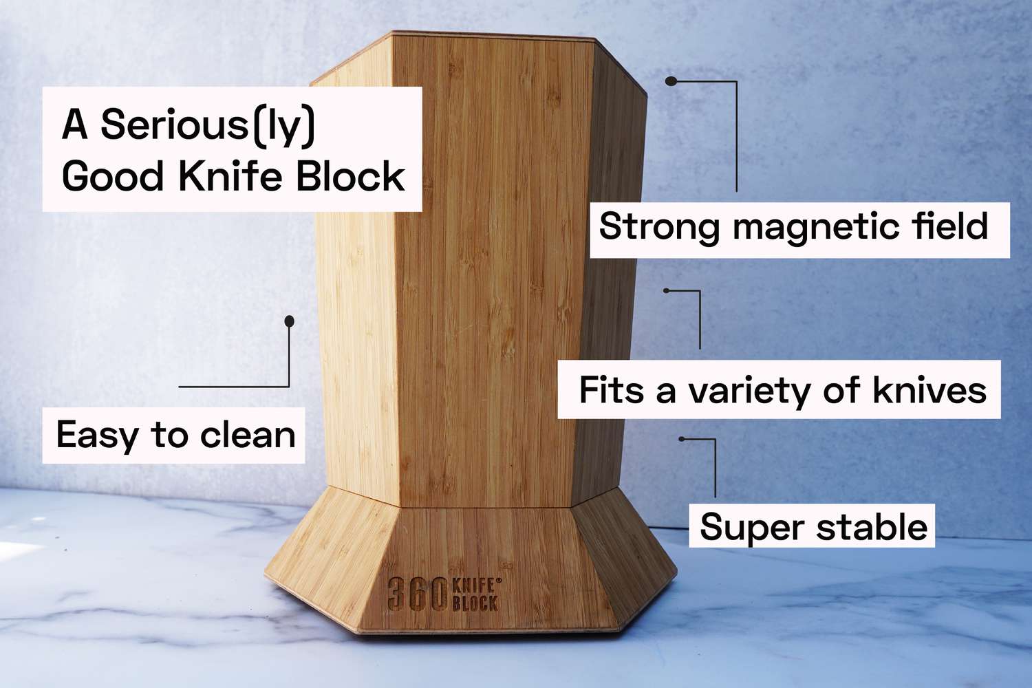 a knife block on a marble surface with text points around it