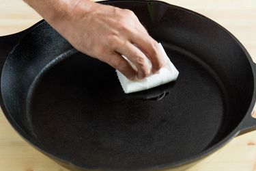 Seasoning a cast iron skillet.