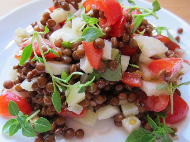 Lentil salad with diced apple, fennel, and tomato with herbs