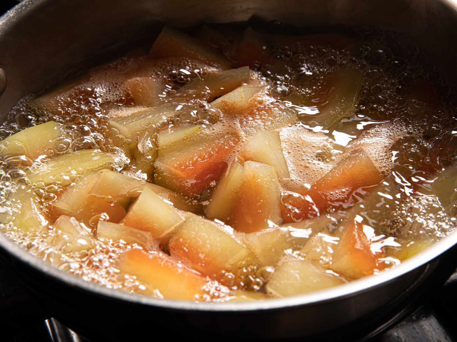 Watermelon rind in boiling mixture