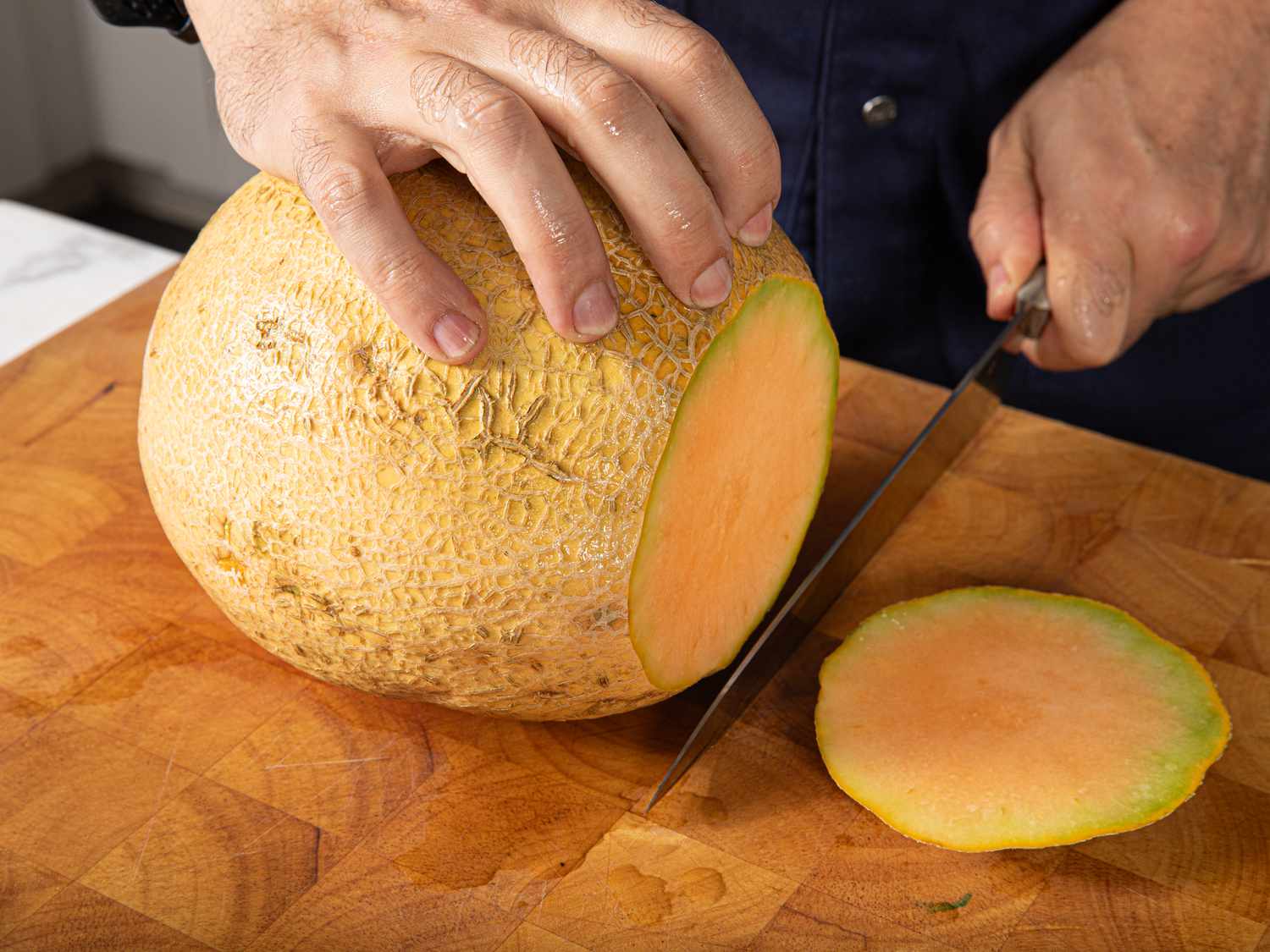 Cutting the ends off of a cantalope