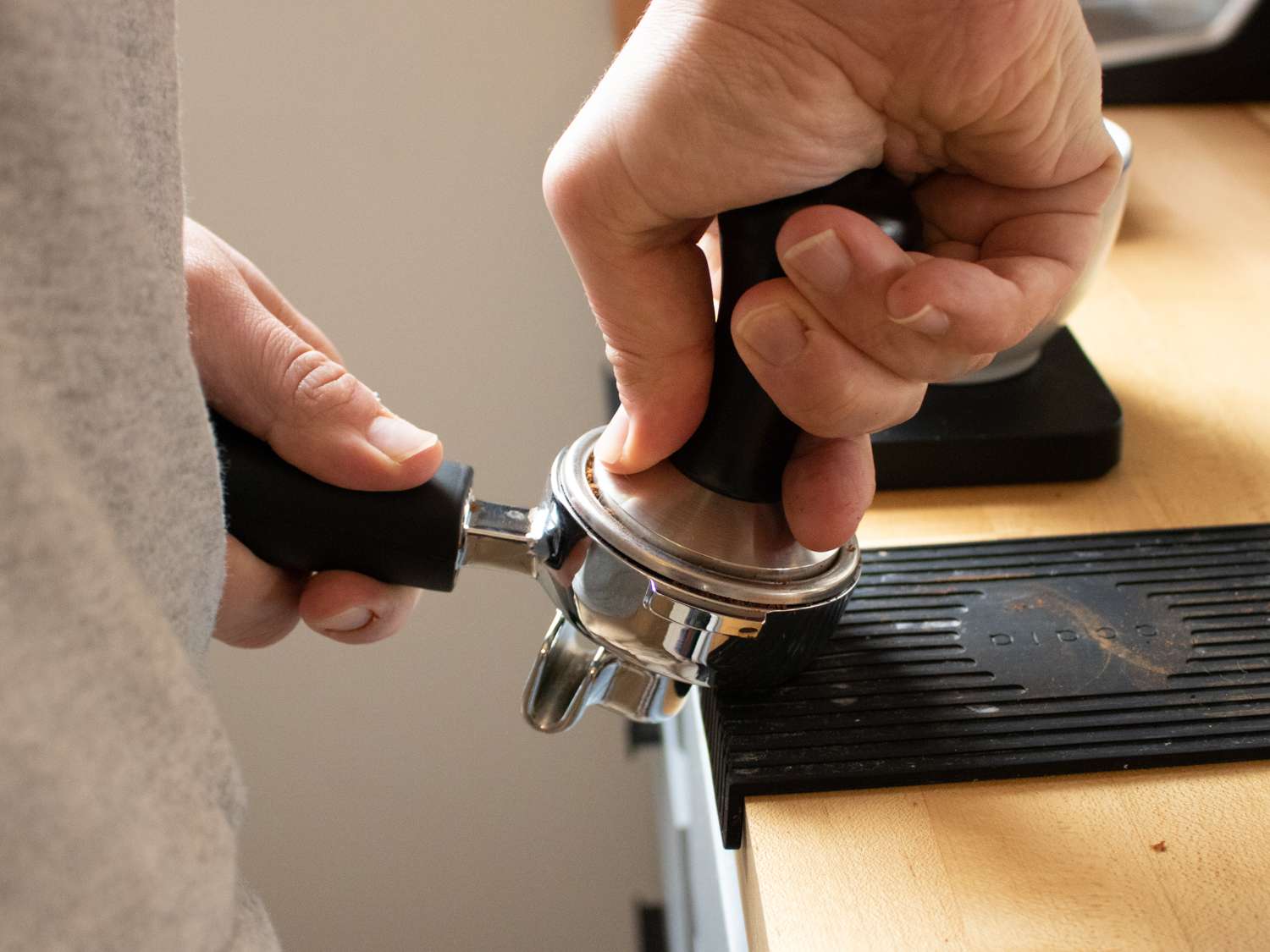 Tamping espresso with a higher-end metal tamper