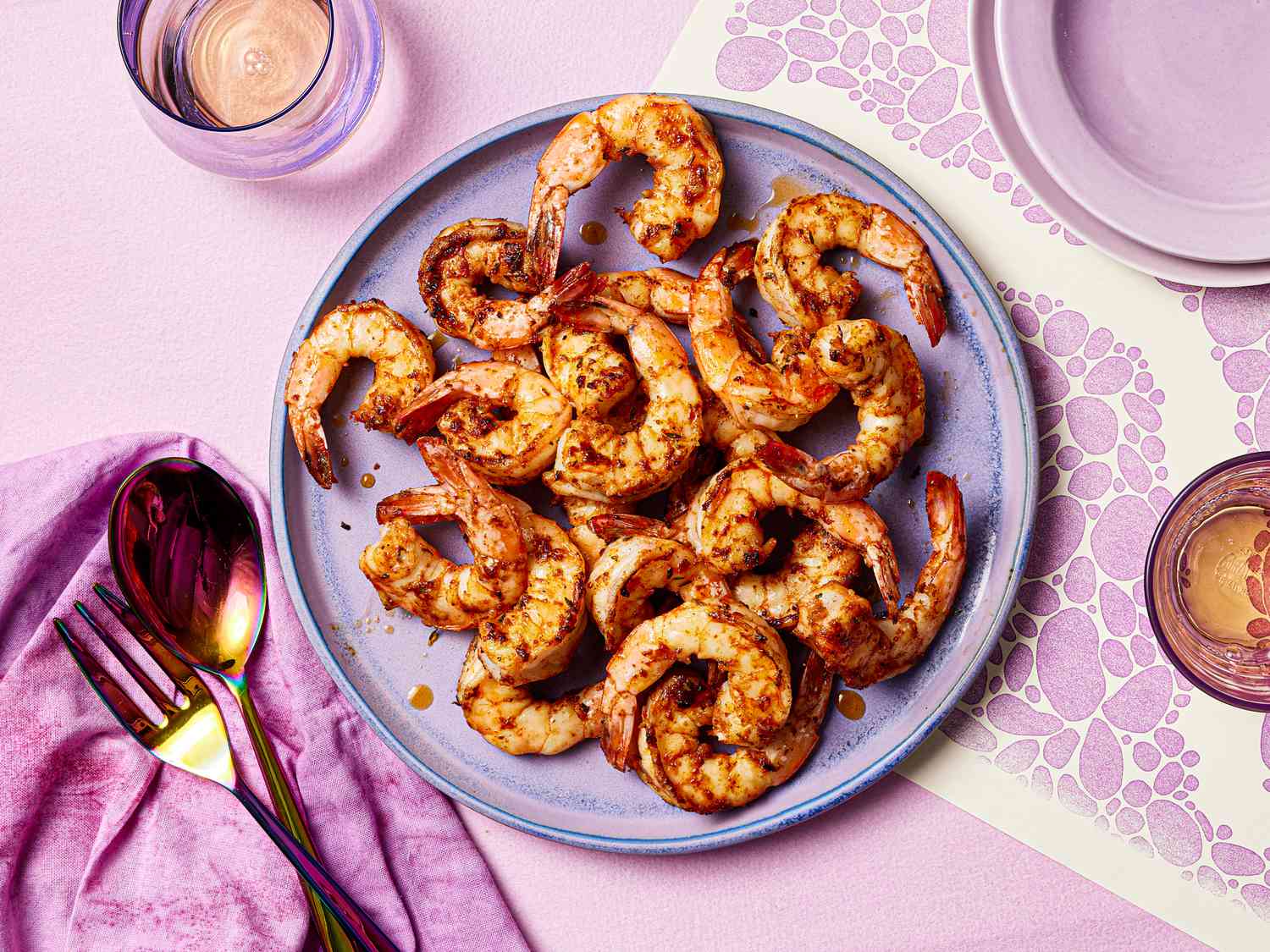 Cajun shrimp on a purple plate.