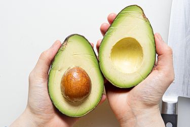 Overhead view of a cut avocado